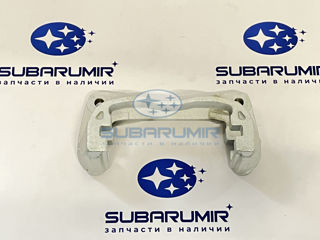 Фото автомобильной запчасти Скоба суппорта передняя правая под диски AE071 (оригинальный номер 26225AG100)