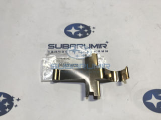 Фото автомобильной запчасти Скобка суппорта тормозного переднего WRX. (оригинальный номер 26232FA020)